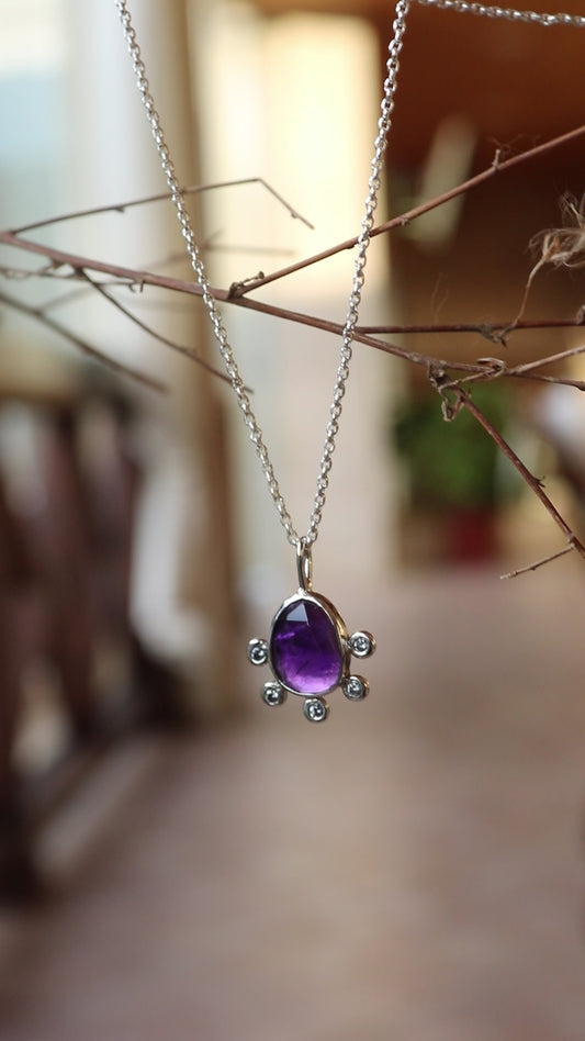 Amethyst pendant with 5 zircons